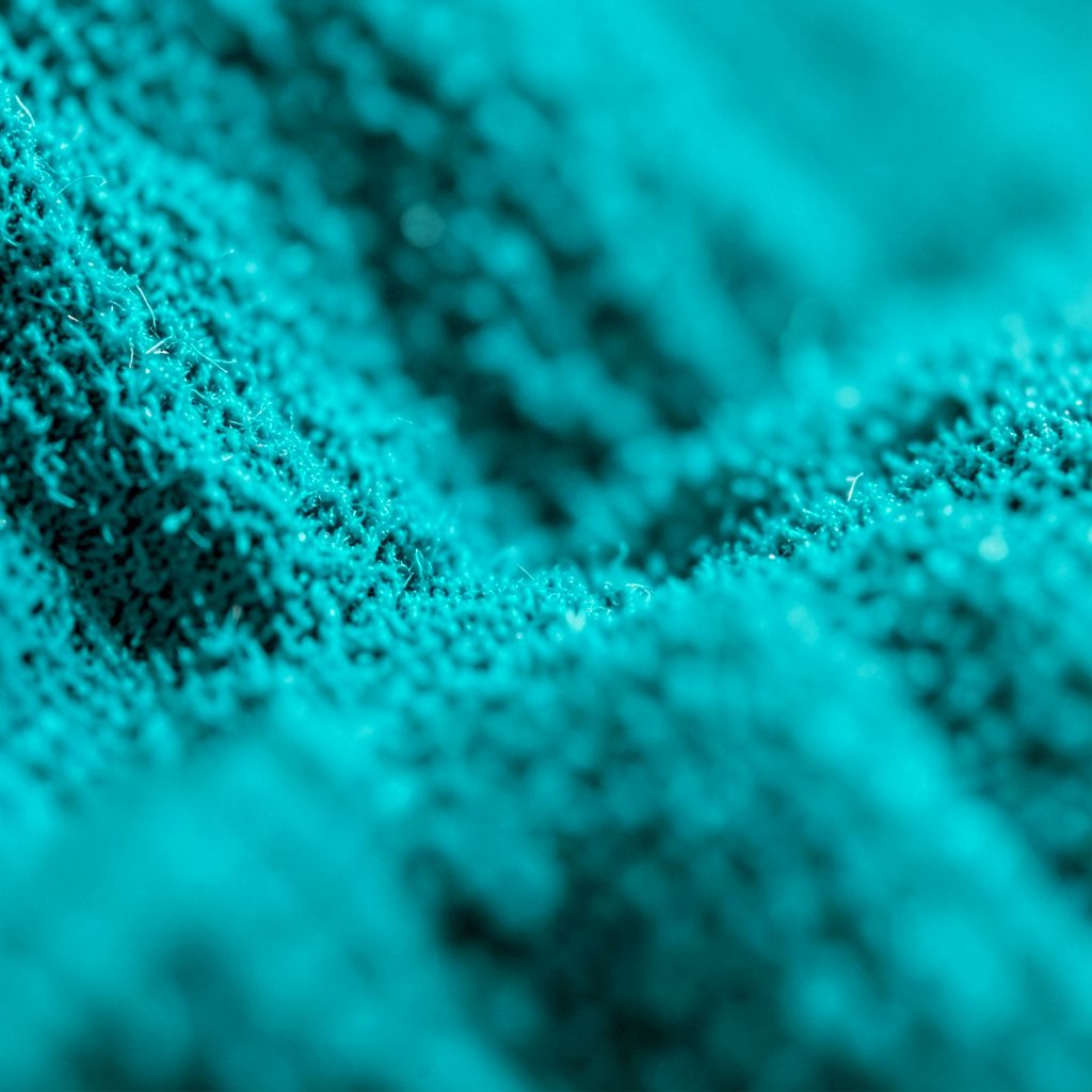 Soft pastel background with gentle gradient of pale teal and cream, suggesting calm and quiet contemplation.